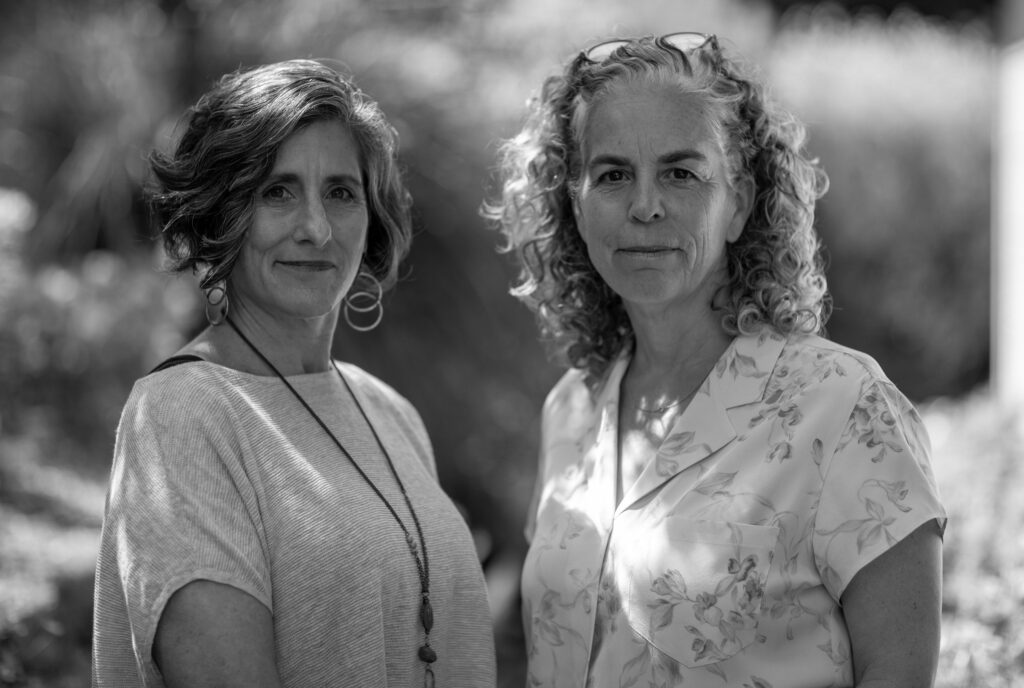 Black and white photo of Rachel Antell and Jen Petrucelli 